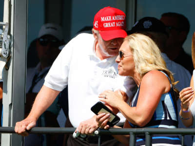 Former President Donald Trump and Rep. Marjorie Taylor Greene are pictured at the 16th tee during the second round of LIV golf invitational series on July 30, 2022, in Bedminster, New Jersey.