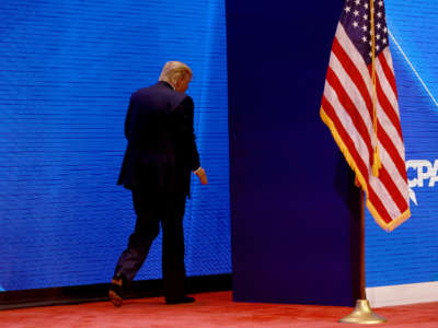 Former President Donald Trump walks off stage after speaking during the Conservative Political Action Conference (CPAC) at The Rosen Shingle Creek on February 26, 2022, in Orlando, Florida.