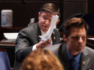 Rep. Mike Johnson holds up a news article during a House Judiciary Committee hearing on June 17, 2020, in Washington, D.C.