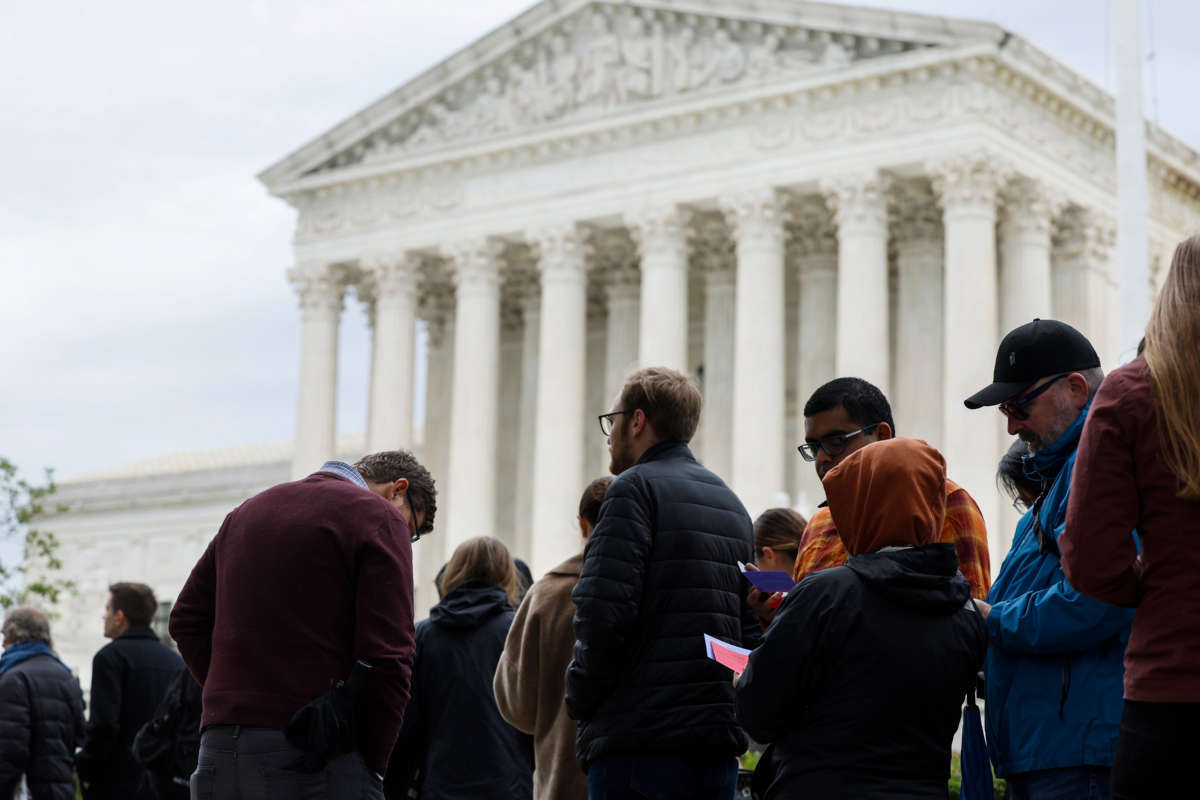People wait in line outside the U.S. Supreme Court building to hear oral arguments on October 3, 2022, in Washington, D.C.