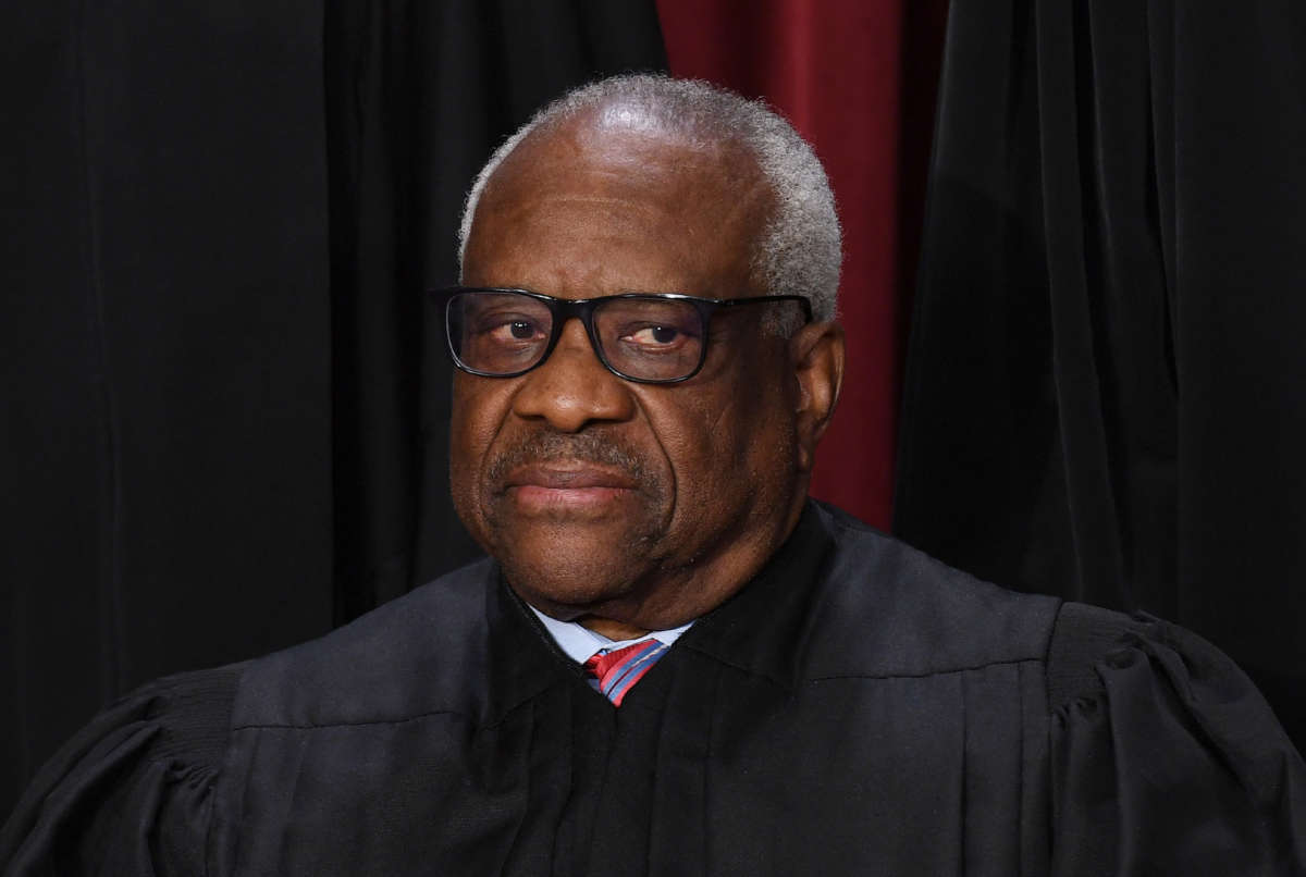 Associate Supreme Court Justice Clarence Thomas poses for the official photo at the Supreme Court in Washington, D.C., on October 7, 2022.