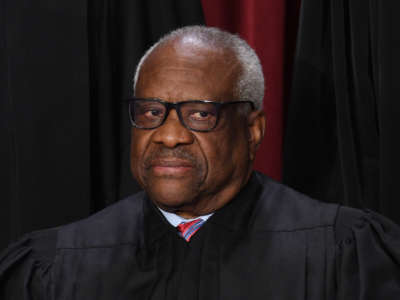 Associate Supreme Court Justice Clarence Thomas poses for the official photo at the Supreme Court in Washington, D.C., on October 7, 2022.