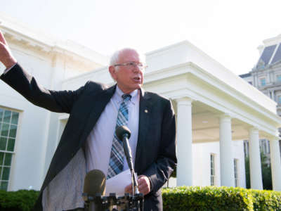 Sen. Bernie Sanders speaks to the media outside the West Wing of the White House in Washington, D.C, on July 12, 2021.