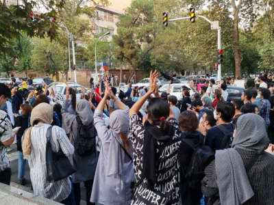 People gather in protest following the death of Mahsa Amini, on September 19, 2022, in Tehran, Iran.