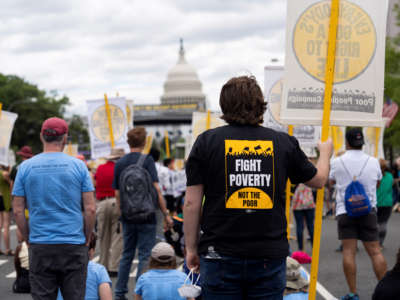 People attend a rally calling for attention to the living conditions of the low-income people in Washington, D.C., on June 18, 2022.