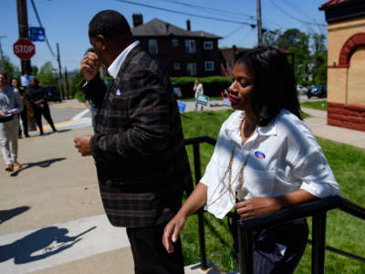 Pennsylvania State Rep. Summer Lee leaves her polling station at the Paulson Recreation Center after voting with Pittsburgh Mayor Ed Gainey, left, on May 17, 2022, in Pittsburgh, Pennsylvania.