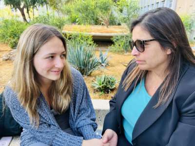 Bayley Frost holds hands outside Kern County Superior Court with her mother, Wendy Howard