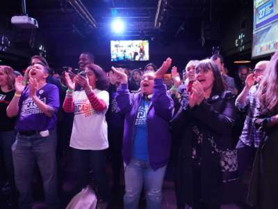 Supporters of Alexandria Ocasio-Cortez cheer during her election night party in Queens, New York on November 6, 2018.