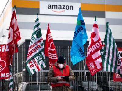 Amazon employees demonstrate for better working conditions in front of the company's premises in Brandizzo, Italy, on March 22, 2021.
