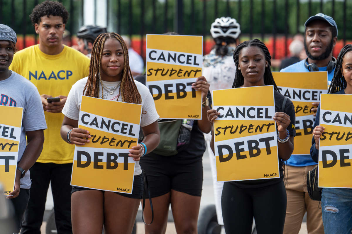 Activists rally outside the White House a day after President Biden announced his student loan debt cancellation plan in Washington, DC, on August 25, 2022.