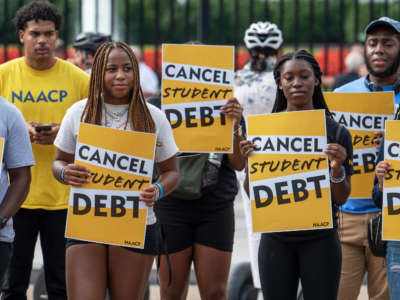 Activists rally outside the White House a day after President Biden announced his student loan debt cancellation plan in Washington, DC, on August 25, 2022.