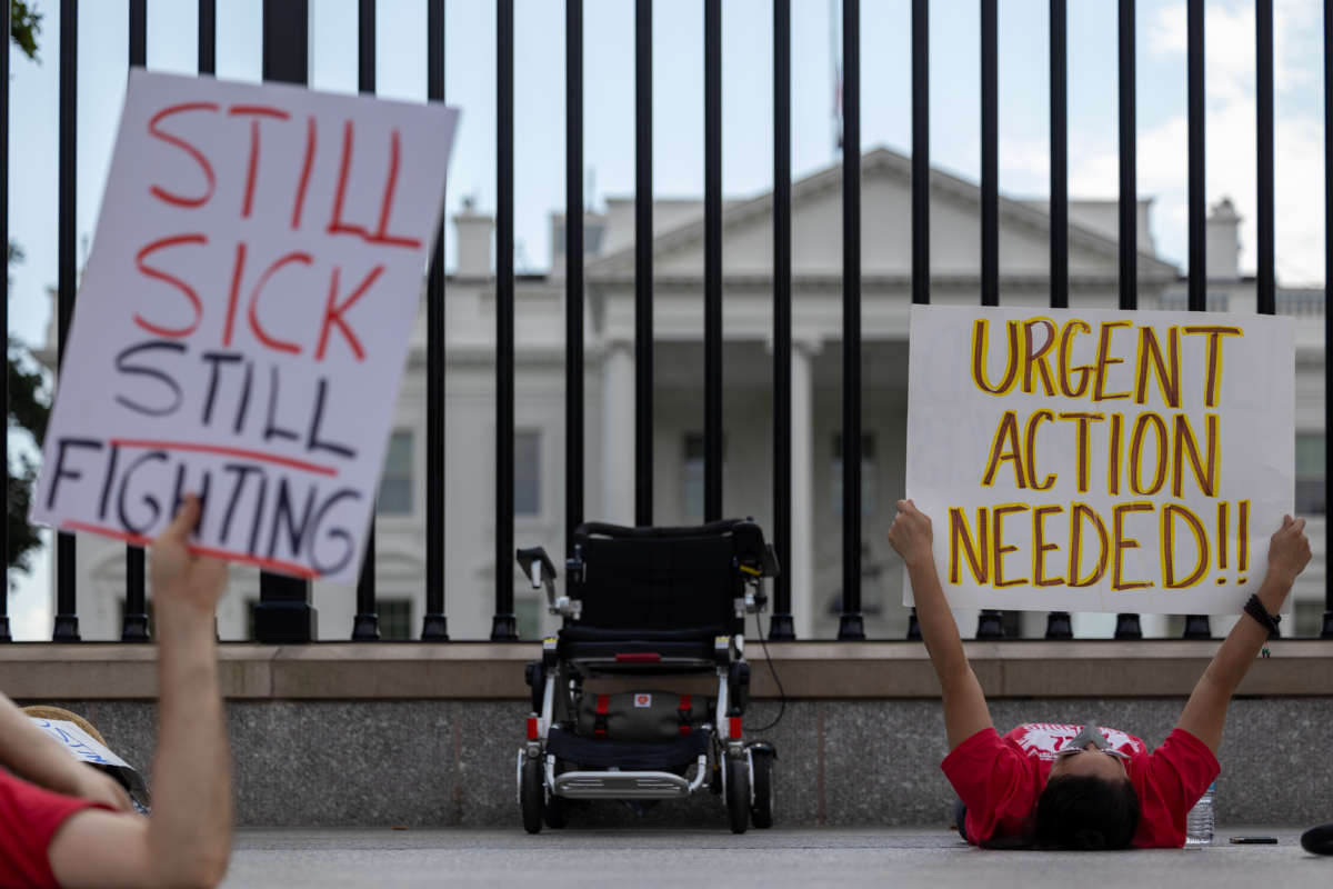 Protestors lay down outside the White House to call attention to those suffering from Myalgic Encephalomyelitis and Long COVID on September 19, 2022, in Washington, D.C.