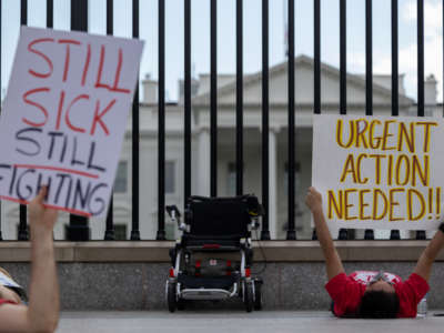 Protestors lay down outside the White House to call attention to those suffering from Myalgic Encephalomyelitis and Long COVID on September 19, 2022, in Washington, D.C.