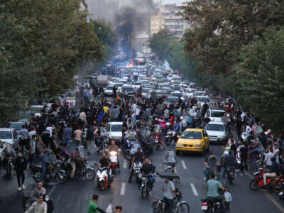 Iranian demonstrators take to the streets of the capital Tehran during a protest for Mahsa Amini on September 21, 2022, days after she died in police custody.