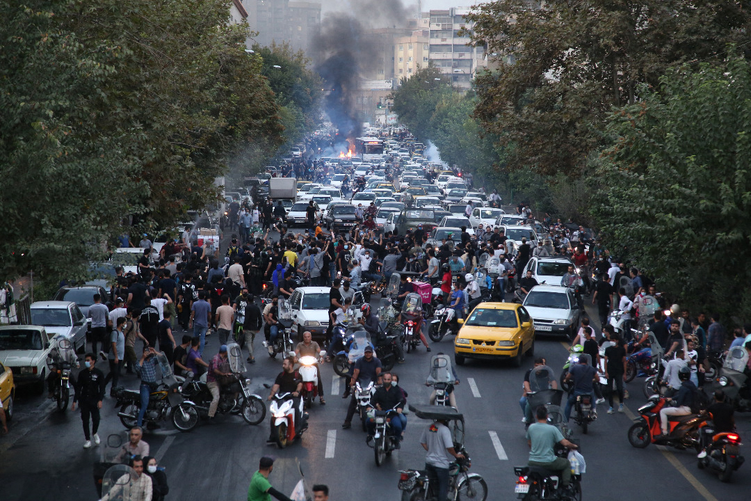 Iranian demonstrators take to the streets of the capital Tehran during a protest for Mahsa Amini on September 21, 2022, days after she died in police custody.