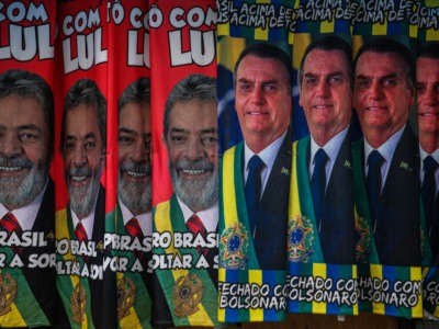 Towels with images of presidential candidates Lula da Silva and Jair Bolsonaro are displayed in a street stand in downtown São Paulo, Brazil, on September 21, 2022, ahead of presidential elections.
