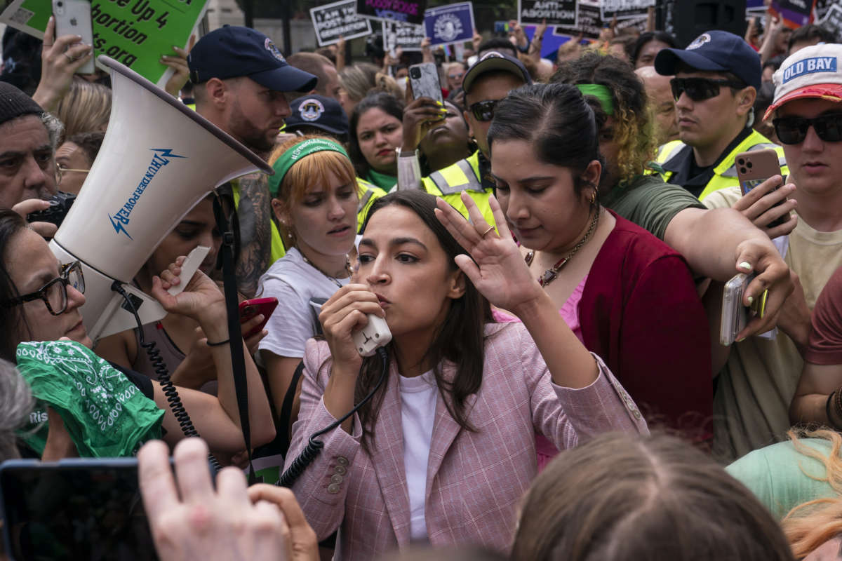 Rep. Alexandria Ocasio-Cortez (D-New York) speaks to abortion-rights activists in front of the U.S. Supreme Court after the Court announced a ruling in the Dobbs v. Jackson Women's Health Organization case on June 24, 2022 in Washington, D.C.