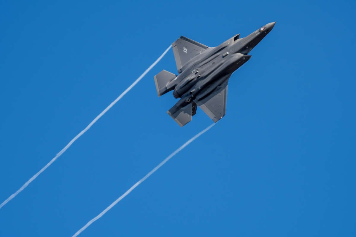 A U.S. F-35 fighter, built by Lockheed Martin, jet flies over the Eifel Mountains near Spangdahlem. The F-35 has cost the government $1.5 trillion in its development, construction and operation.