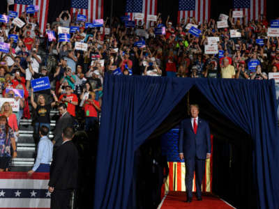 Former President Donald Trump enters the stage at a rally to support Republican candidates running for state and federal offices in the state of Ohio at the Covelli Centre on September 17, 2022, in Youngstown, Ohio.