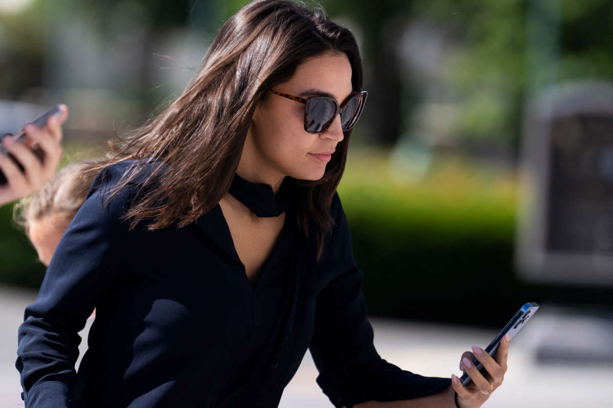 Rep. Alexandria Ocasio-Cortez is seen on the House steps of the U.S. Capitol on June 9, 2022.