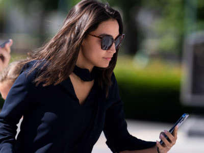 Rep. Alexandria Ocasio-Cortez is seen on the House steps of the U.S. Capitol on June 9, 2022.