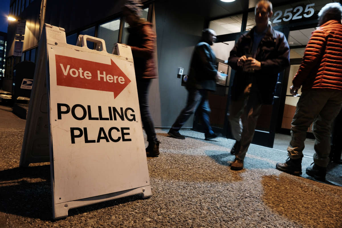 Voters arrive to cast a ballot at a polling station setup in the Region II Elections Office on November 1, 2022, in Anchorage, Alaska.