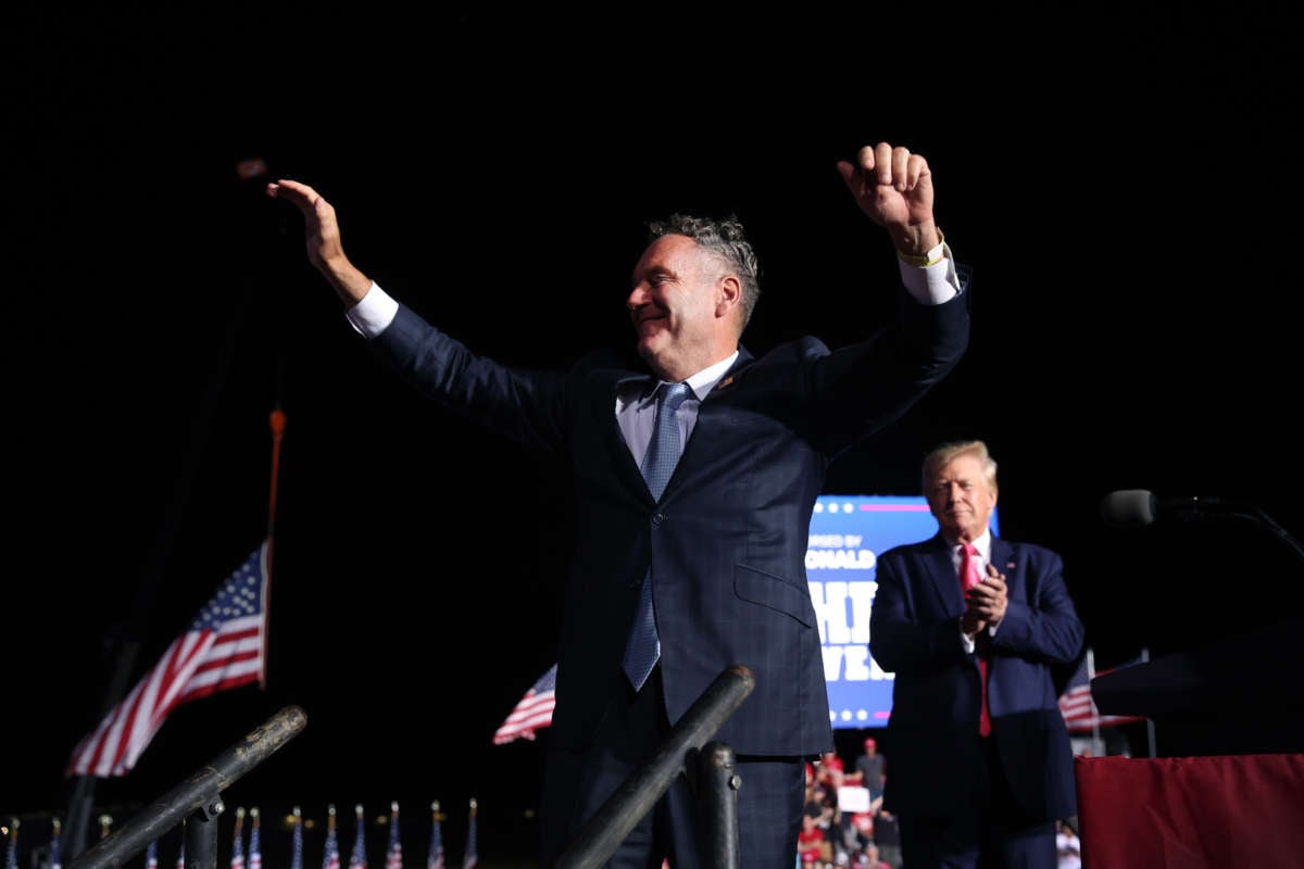 Former President Donald Trump greets Wisconsin Republican gubernatorial candidate Tim Michels during a rally on August 5, 2022, in Waukesha, Wisconsin.