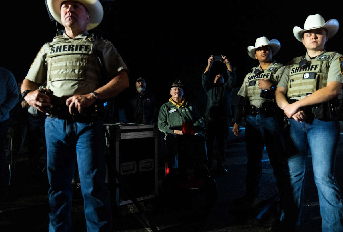 Members of the Culpeper County Sheriff's Office attend an early vote rally with Yesli Vega, Republican candidate for Virginias 7th Congressional district, and Virginia Gov. Glenn Youngkin at the Brandy Station, Virginia, on November 1, 2022.