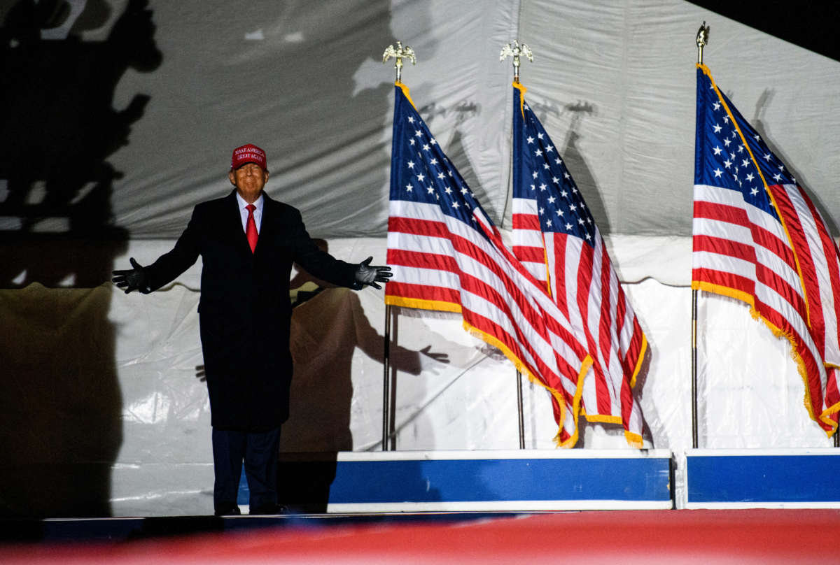 Former President Donald Trump arrives during a campaign event at Sioux Gateway Airport on November 3, 2022, in Sioux City, Iowa.