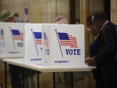 Voters fill out mail-in ballots at the Board of Elections office in the Allegheny County Office Building on November 3, 2022, in Pittsburgh, Pennsylvania.