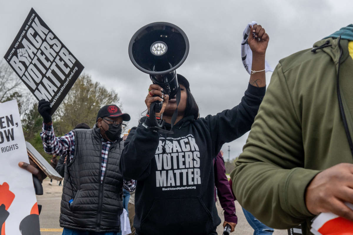 Demonstrators take part in the Black Voters Matter's 57th Selma to Montgomery March on March 9, 2022, in Selma, Alabama.