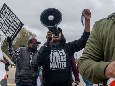 Demonstrators take part in the Black Voters Matter's 57th Selma to Montgomery March on March 9, 2022, in Selma, Alabama.