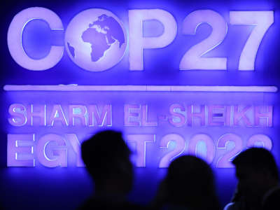 A sign stands illuminated in the plenary hall at the UNFCCC COP27 climate conference on November 7, 2022, in Sharm el Sheikh, Egypt.