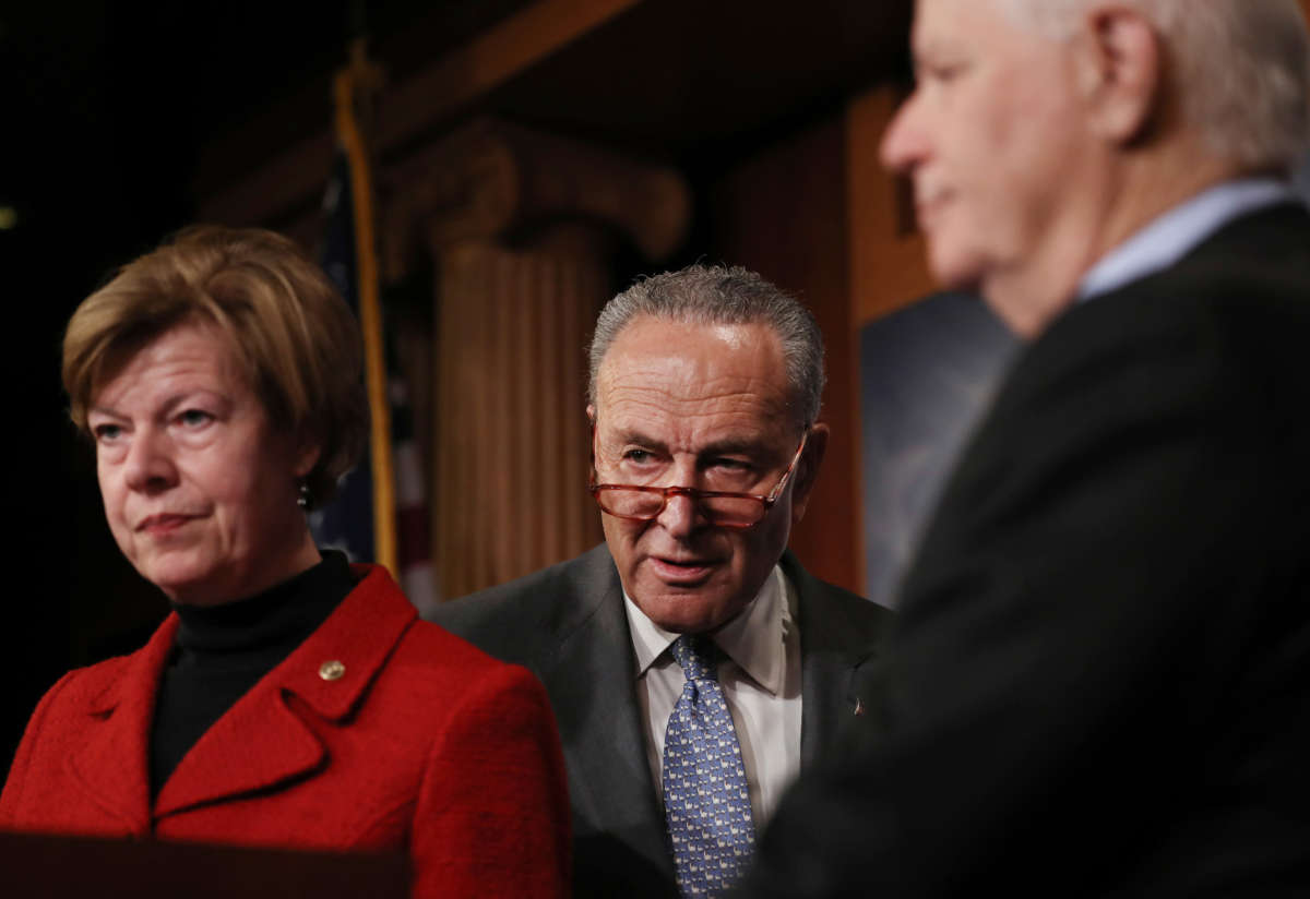 From left, Sen. Tammy Baldwin, Senate Minority Leader Chuck Schumer and Sen. Ben Cardin attend a news conference at the U.S. Capitol on January 27, 2020, in Washington, D.C.