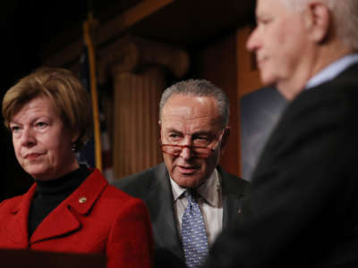 From left, Sen. Tammy Baldwin, Senate Minority Leader Chuck Schumer and Sen. Ben Cardin attend a news conference at the U.S. Capitol on January 27, 2020, in Washington, D.C.