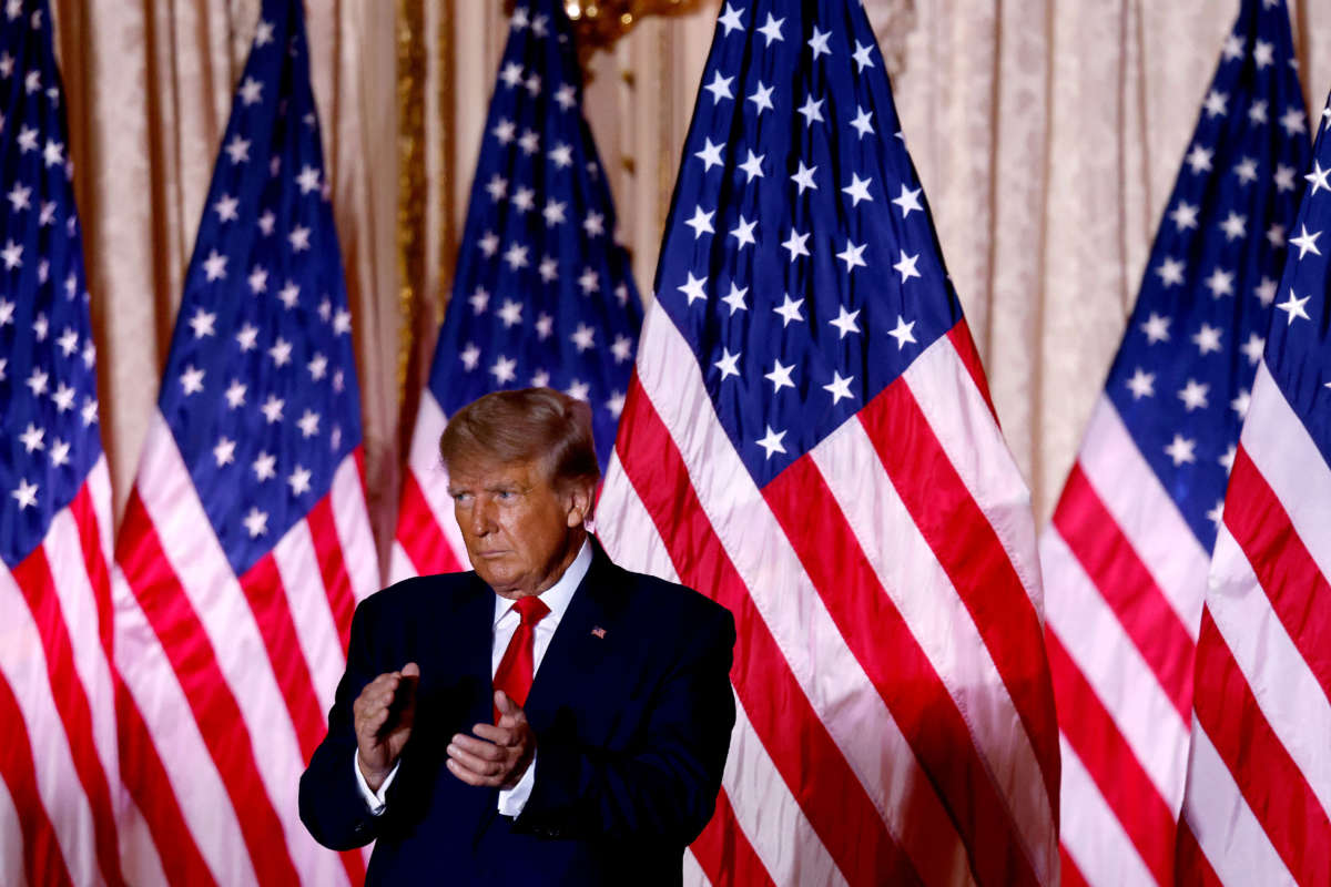 Former President Donald Trump applauds while speaking at the Mar-a-Lago Club in Palm Beach, Florida, on November 15, 2022.