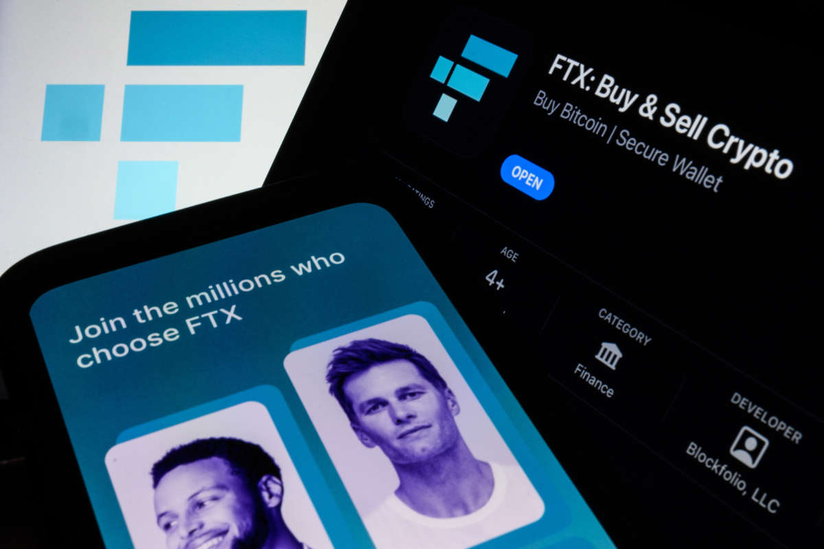 In this photo illustration the FTX logo and mobile app adverts are displayed on screens.