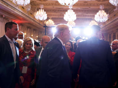 Former President Donald Trump mingles with supporters during an election night event at Mar-a-Lago on November 8, 2022, in Palm Beach, Florida.