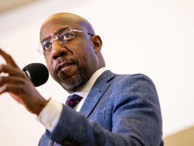 Sen. Raphael Warnock speaks at a campaign rally at the Tubman Museum on November 17, 2022, in Macon, Georgia.