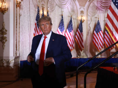 Former President Donald Trump leaves the stage after speaking during an event at his Mar-a-Lago home on November 15, 2022, in Palm Beach, Florida.