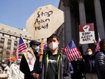 A young boy rallies with others to protest anti-Asian hate crimes, at Foley Square in New York City, on April 4, 2021.