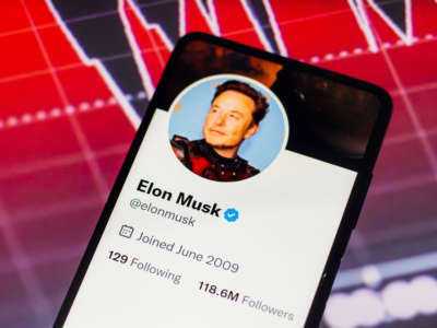 Elon Musk's Twitter account is seen displayed on a smartphone screen.