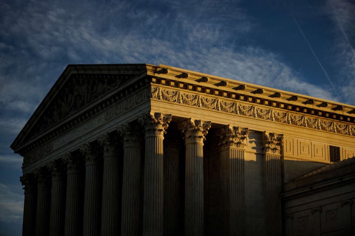 The rising sun creeps across the Supreme Court on November 8, 2022, in Washington, D.C.