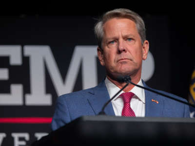 Georgia Governor Brian Kemp speaks at a podium