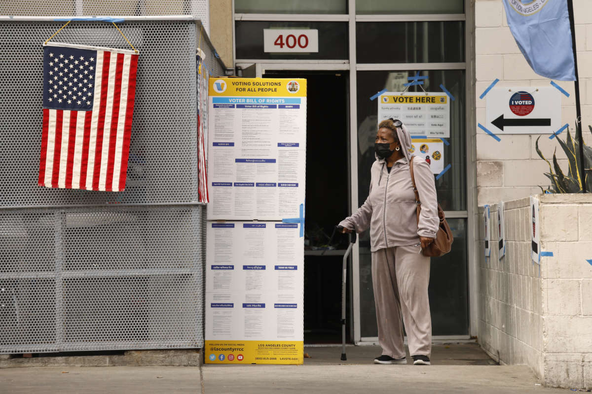 A woman who is living at the Union Rescue Mission cast her vote at the James Wood Community Center at in downtown Los Angeles on June 7, 2022.