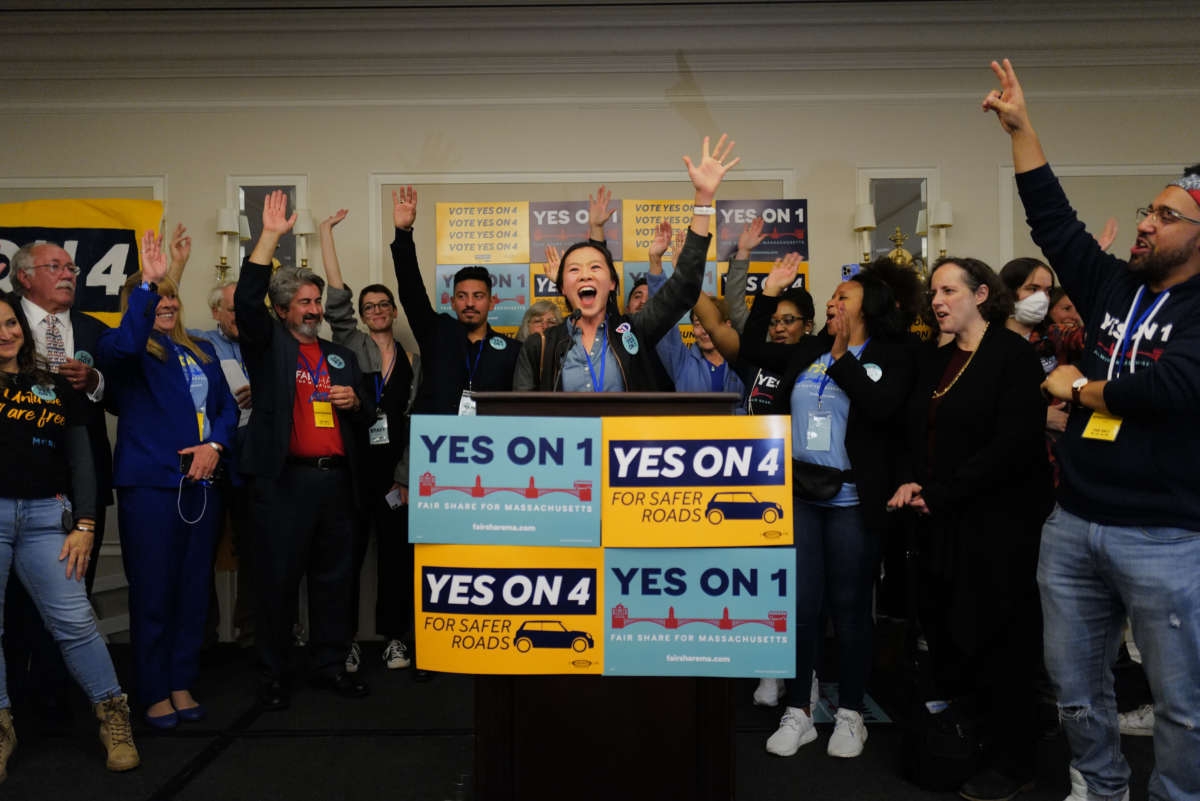 Supporters take the stage to celebrate a likely victory at the Yes on 1 and Yes on 4 event for the 2022 Midterm Elections at the Colonnade Hotel in Boston, Massachusetts on November 9, 2022.