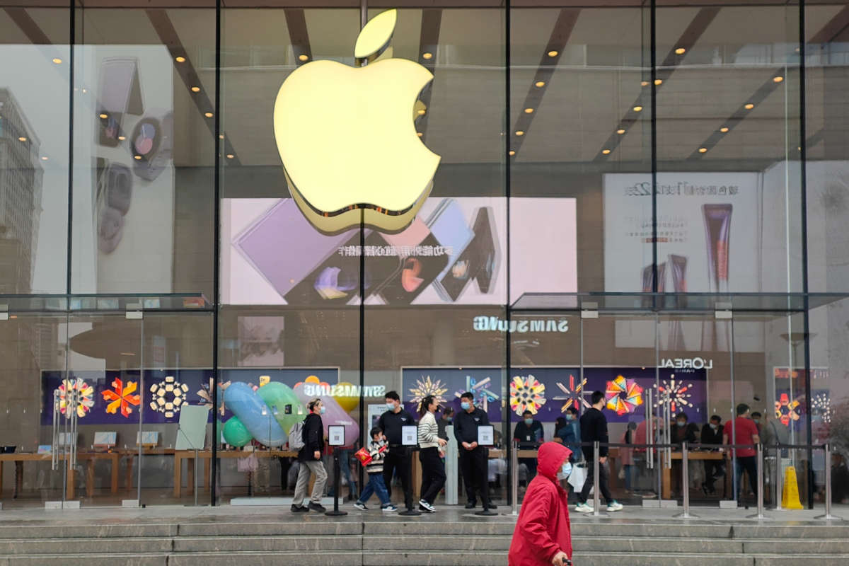 Customers try out the iPhone14, manufactured by Foxconn workers, at an Apple store in Shanghai, China, on November 11, 2022.