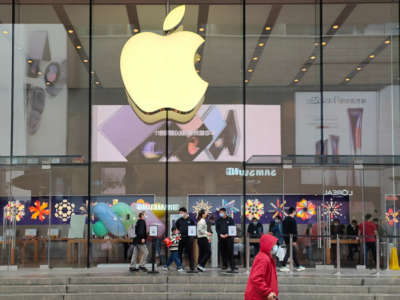 Customers try out the iPhone14, manufactured by Foxconn workers, at an Apple store in Shanghai, China, on November 11, 2022.