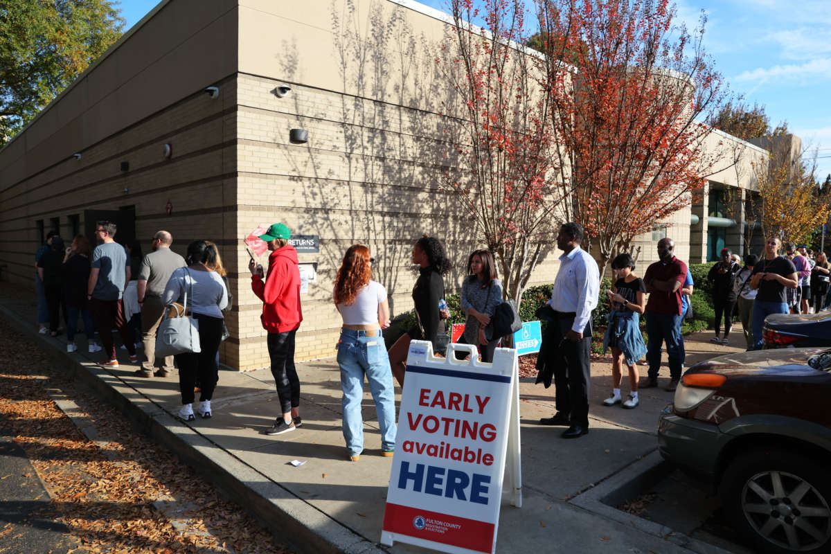 People wait in line for early voting for the midterm elections at Joan P. Garner Library at Ponce De Leon on November 4, 2022 in Atlanta, Georgia.