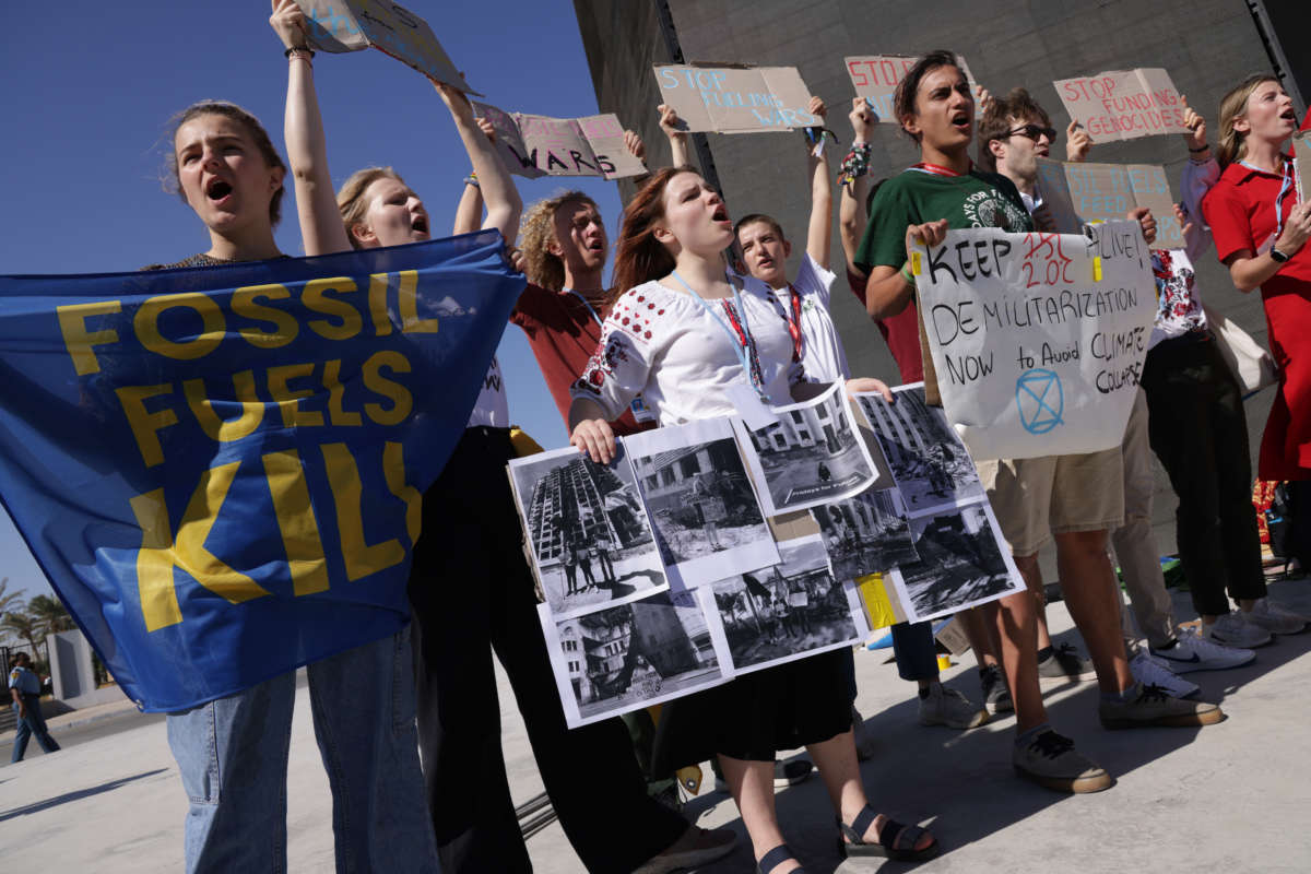 Protesters demanding an end to fossil fuel dependence that enables wars, including Russia's current war in Ukraine, demonstrate during the UNFCCC COP27 climate conference on November 12, 2022, in Sharm el-Sheikh, Egypt.